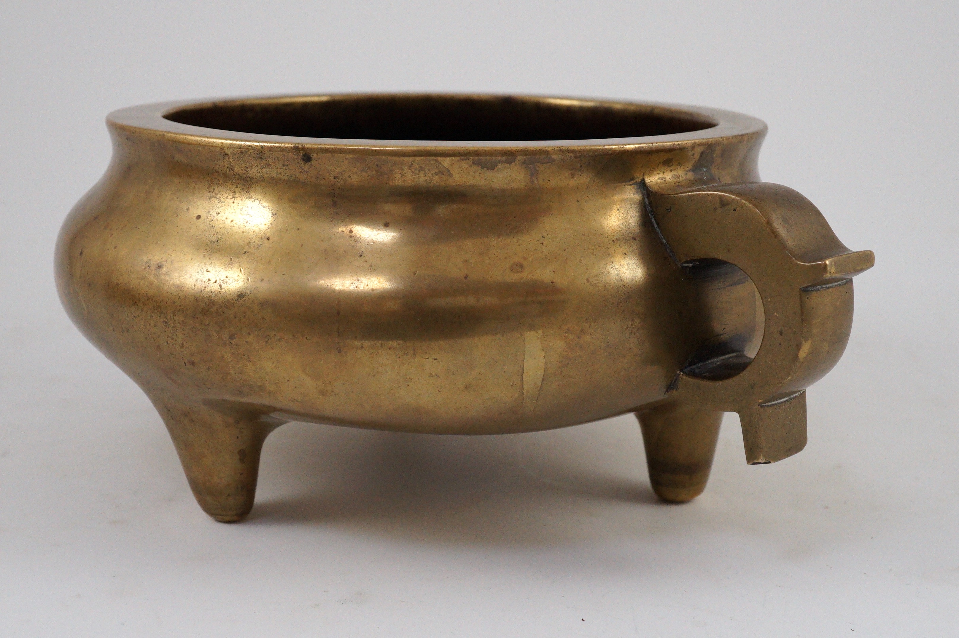 A large Chinese bronze censer, ding, 18th century, with sixteen character Xuande mark, 29cm wide